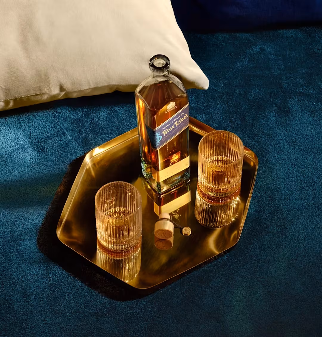 Johnnie Walker Blue Label bottle and whisky glasses, a Diageo brand from Voxly's marketing compliance AI pilot