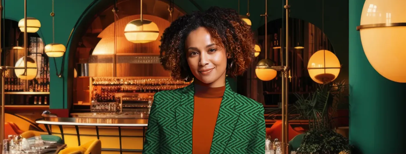 Woman in a green blazer in a restaurant, typical banking ad imagery Voxly Vision checks against BCOBS 2