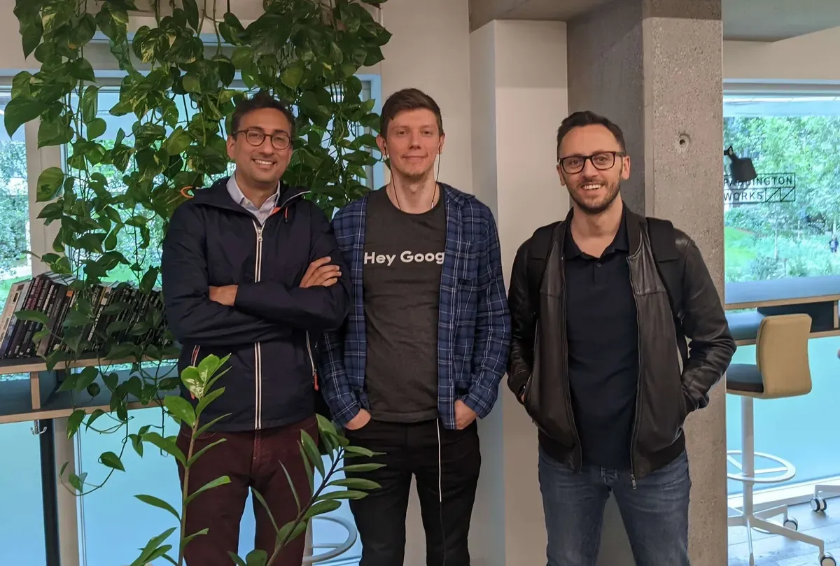 Three Voxly Vision team members building AI ad compliance software in the office