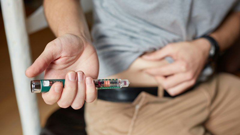 Person using an injection pen, a prescription-only medicine that can't be advertised to the public