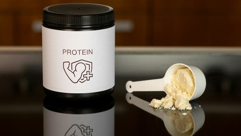 Protein powder and scoop, the supplements covered by the health claims register