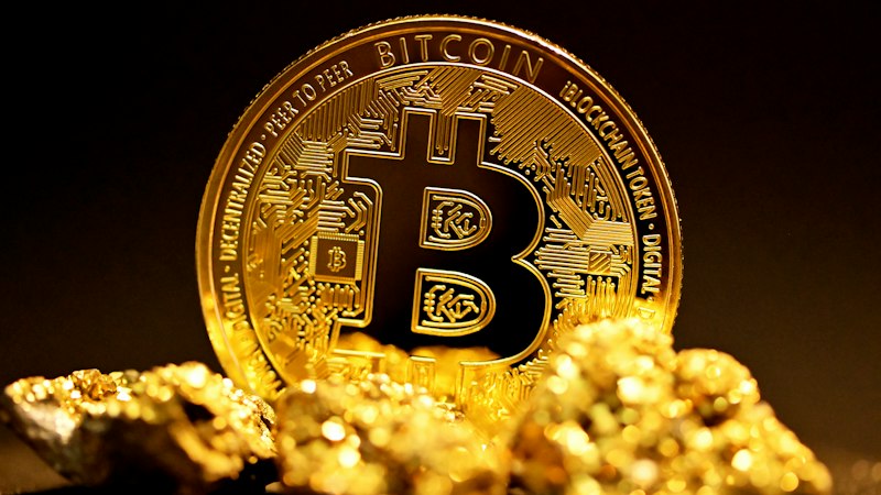 Bitcoin coin on gold nuggets, the cryptoassets the FCA promotion rules cover